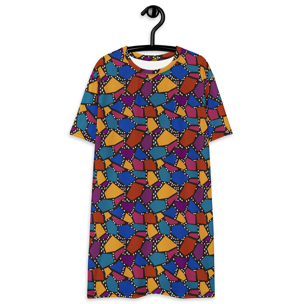 Striking geometric patterned t-shirt dress in a vibrant futuristic Synthwave colour palette against a black and white dotted background. Available here in a muted rainbow style.