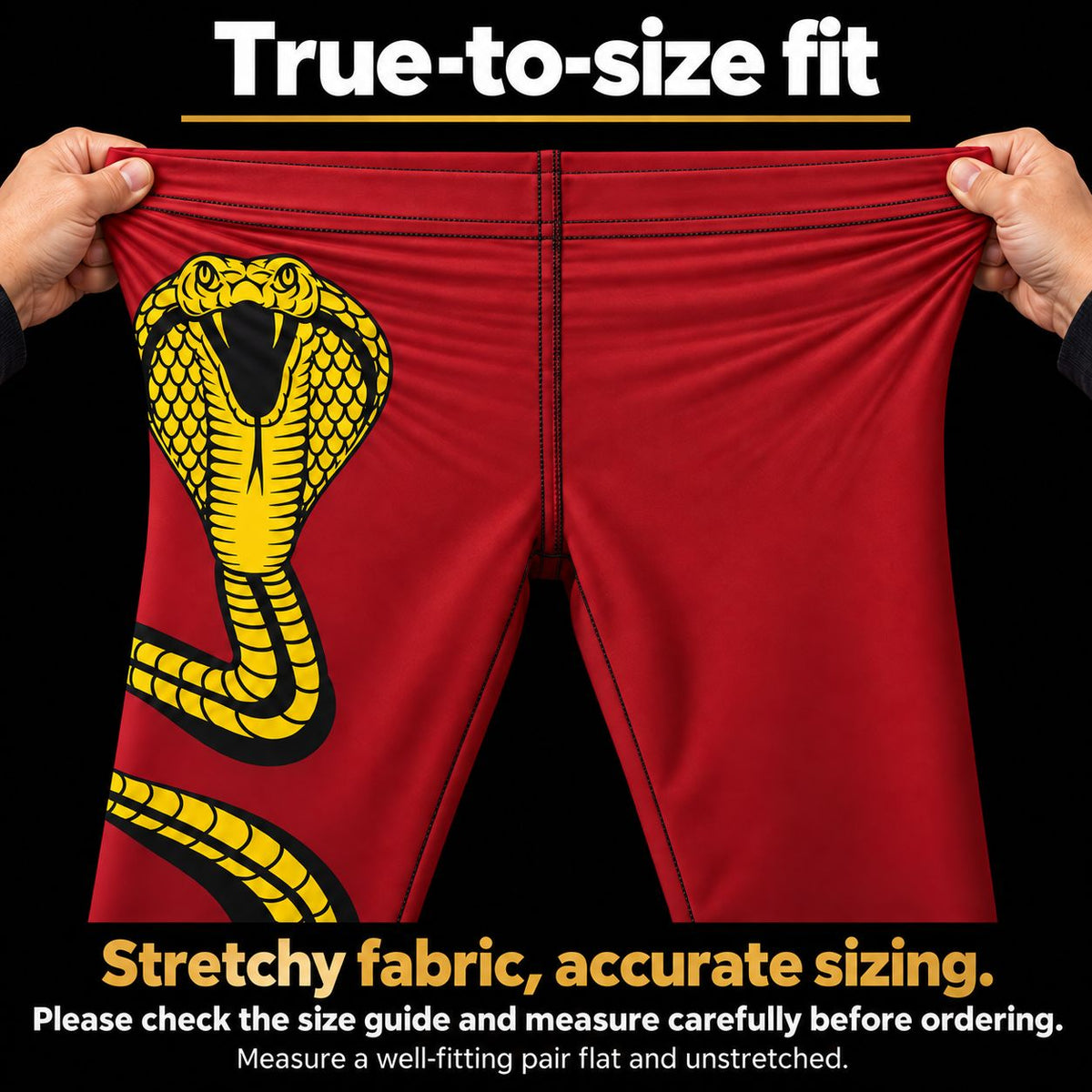 Red athletic shorts with a large yellow and black cobra snake graphic on the left leg, being stretched by two hands against a black background. Text at the top reads 'True-to-size fit' and text at the bottom describes stretchy fabric and accurate sizing.