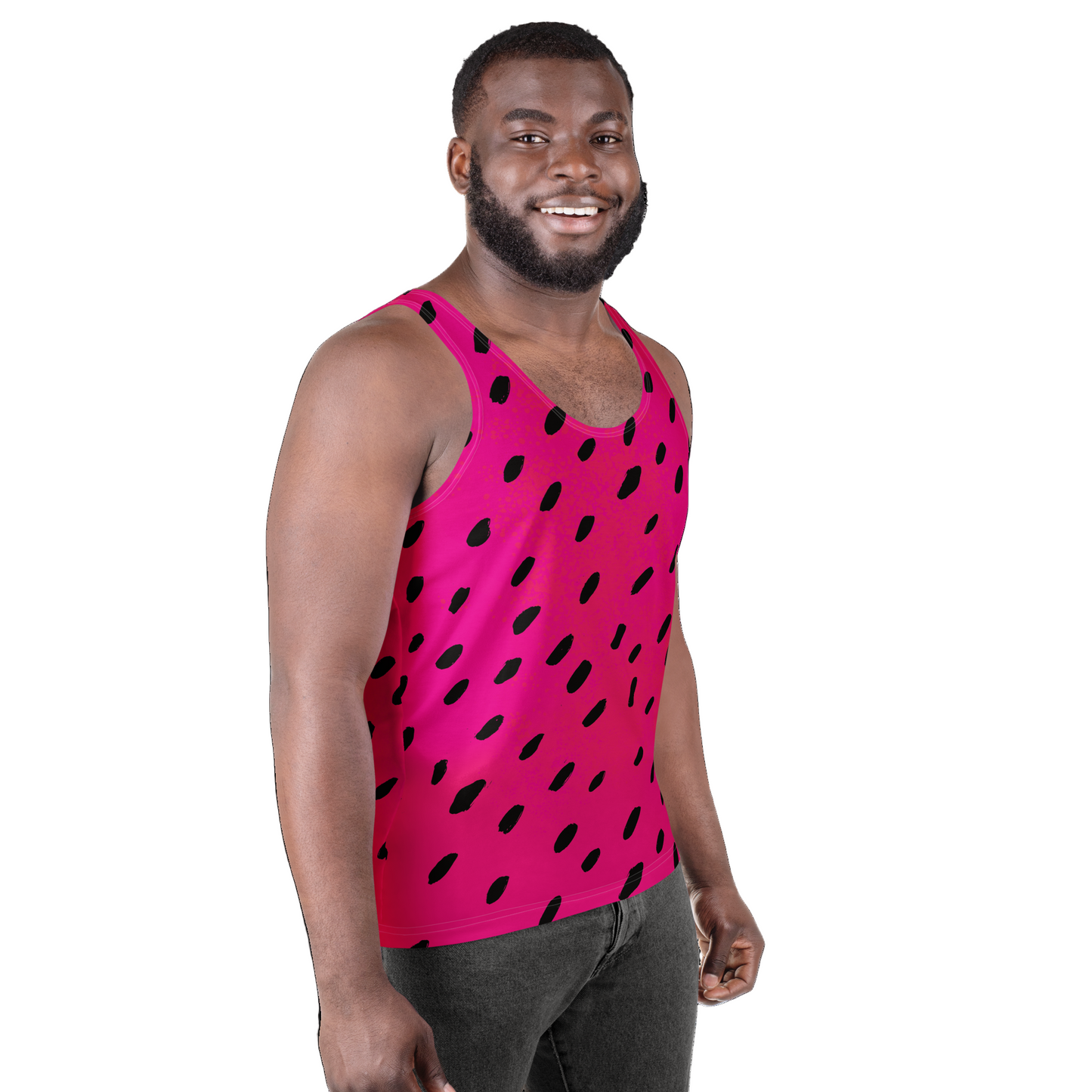 Man wearing a pink tank top with black polka dots on a white background