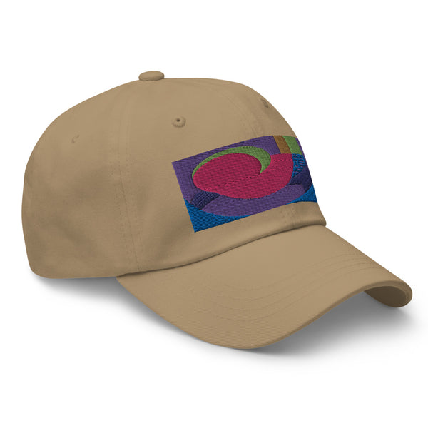 khaki dad hat with colorful rectangular logo containing blocks of colors of pink, purple, green and blue, curves and geometric shapes in a mid-century modernist abstract composition