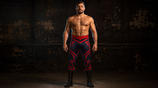 Athletic man standing front-on in full-length pro wrestling tights, shot from ankle to crown