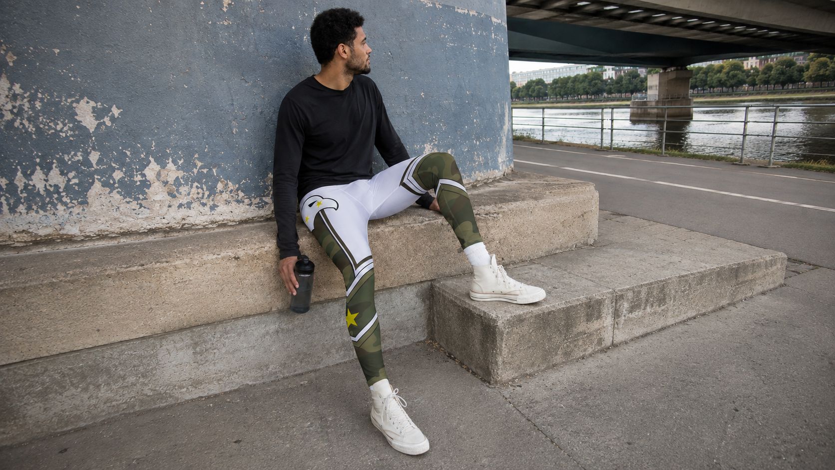 Camouflage wrestling tights for men, showing the olive and white camo print on the legs and the eagle graphic across the upper body