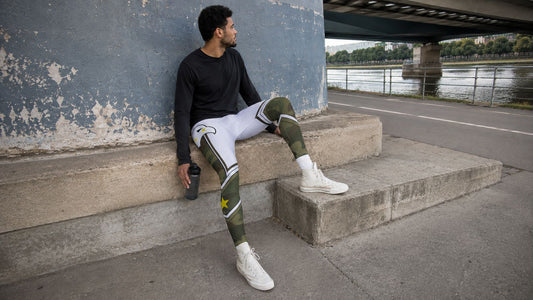 Camouflage wrestling tights for men, showing the olive and white camo print on the legs and the eagle graphic across the upper body