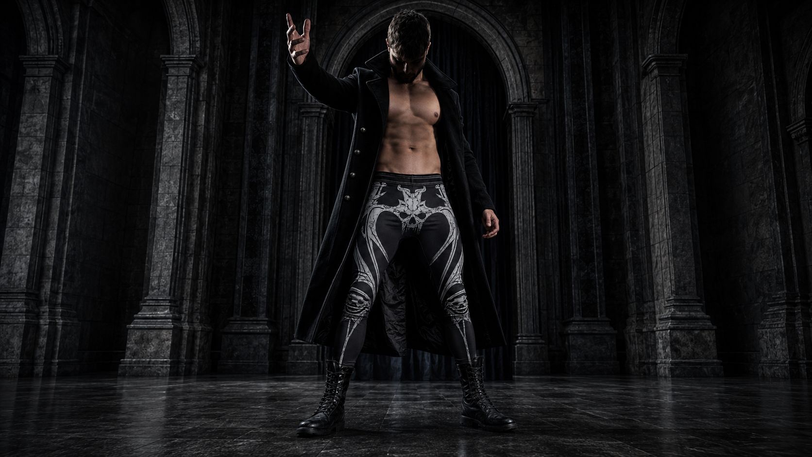 Man wearing dark gothic wrestling tights with a skull or bone-geometry print, black base, grey or bone-white detailing
