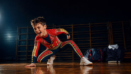 Boy wearing red and navy American hero cosplay wrestling outfit