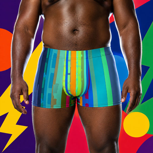 Person wearing colorful striped boxer briefs against a multicolored abstract background