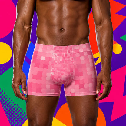 Person wearing pink patterned underwear against a colorful geometric background