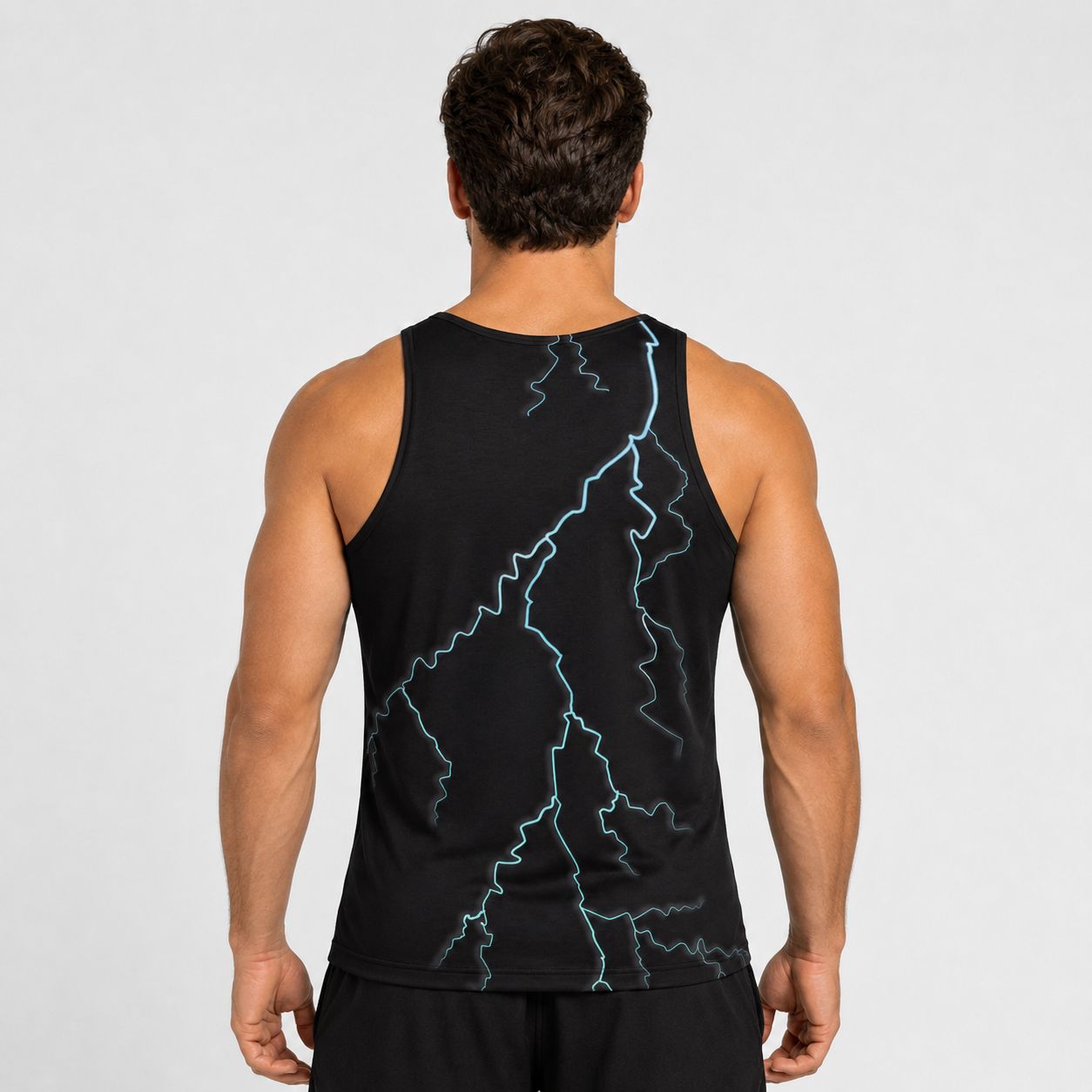 Person wearing a black tank top with blue lightning bolt design on a plain background