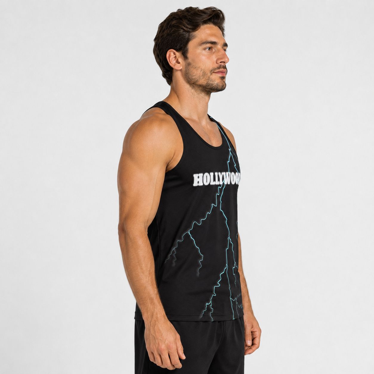 Man wearing a black tank top with 'Hollywood' text and blue lightning bolt on a white background