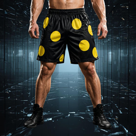 Person wearing black shorts with large yellow polka dots on a dark reflective surface
