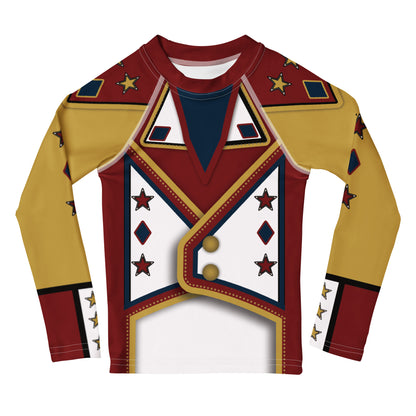 Front of the Drum Major kids rash guard - gold sleeves, crimson parade-jacket print, red stars, navy diamonds and two gold buttons