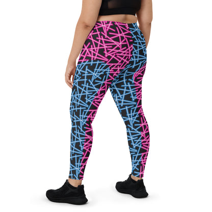 Neoncore style leggings for women with scattering pattern of neon stripes in blue and pink on these printed pro wrestling style tights. Mid rise elasticated waistband and ankle length legs in opposite colors with reverse insets.