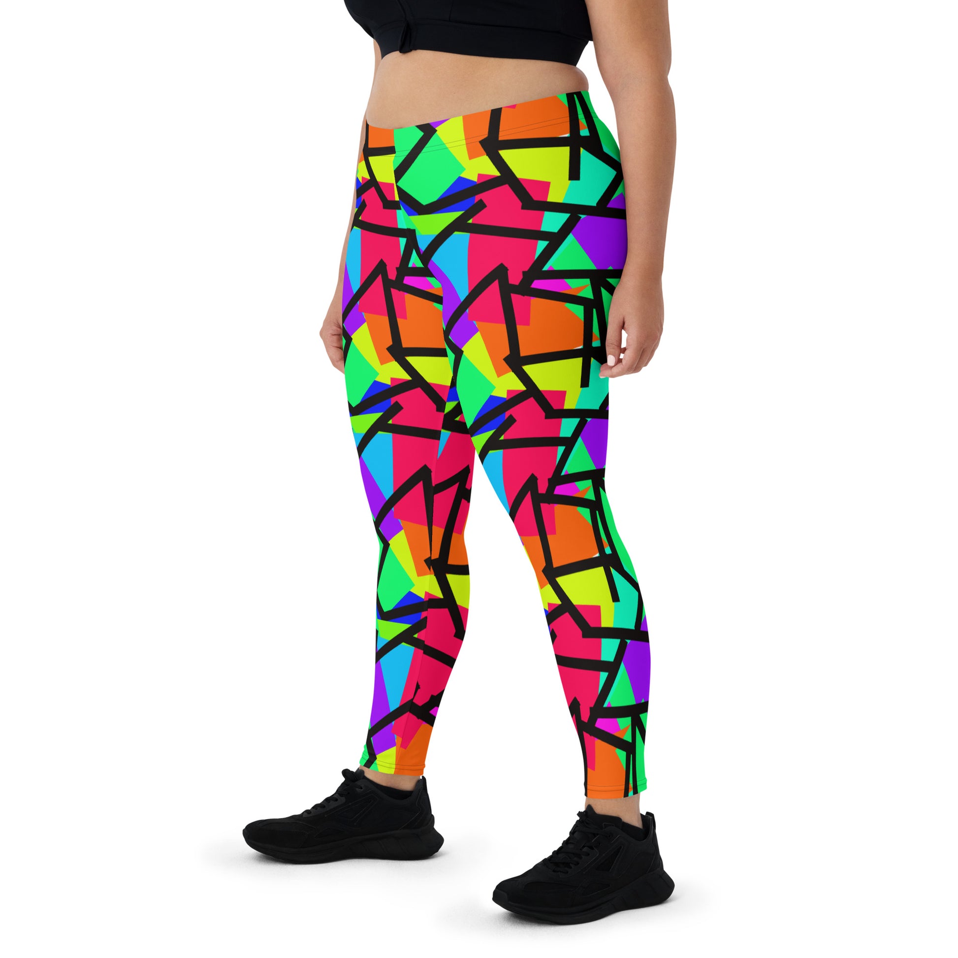 Harajuku Yume Kawaii fashion meggings or womens leggings in brightly coloured Pop Kei 80s Memphis design in red, orange, green, purple, yellow and turquoise geometric shapes and a black zigzag overlay on these neon funky running tights for women.