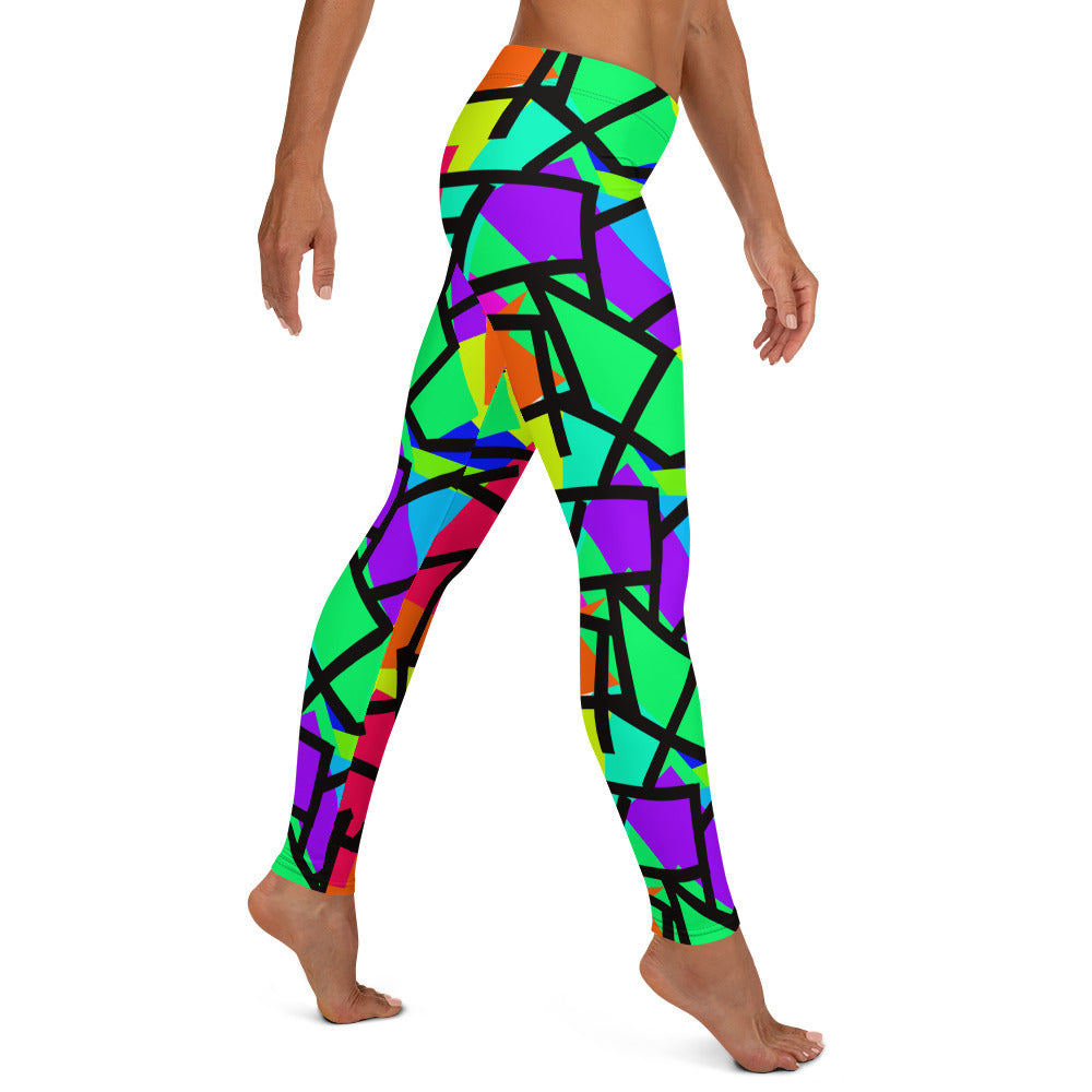 Harajuku Yume Kawaii fashion meggings or womens leggings in brightly coloured Pop Kei 80s Memphis design in red, orange, green, purple, yellow and turquoise geometric shapes and a black zigzag overlay on these neon funky running tights for women.