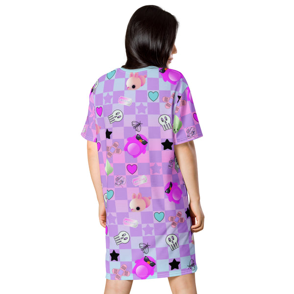 Menhera kei dress in pastel goth style with yami kawaii jfashion harajuku pattern of skulls, razor blades and sticking plasters mixed with yume kawaii cute motifs of mochi penguins, seals and mice against a pastel checked or chequered background.