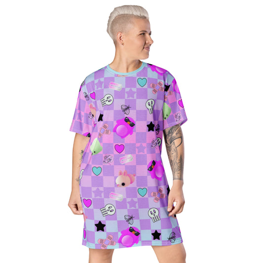 Menhera kei dress in pastel goth style with yami kawaii jfashion harajuku pattern of skulls, razor blades and sticking plasters mixed with yume kawaii cute motifs of mochi penguins, seals and mice against a pastel checked or chequered background.