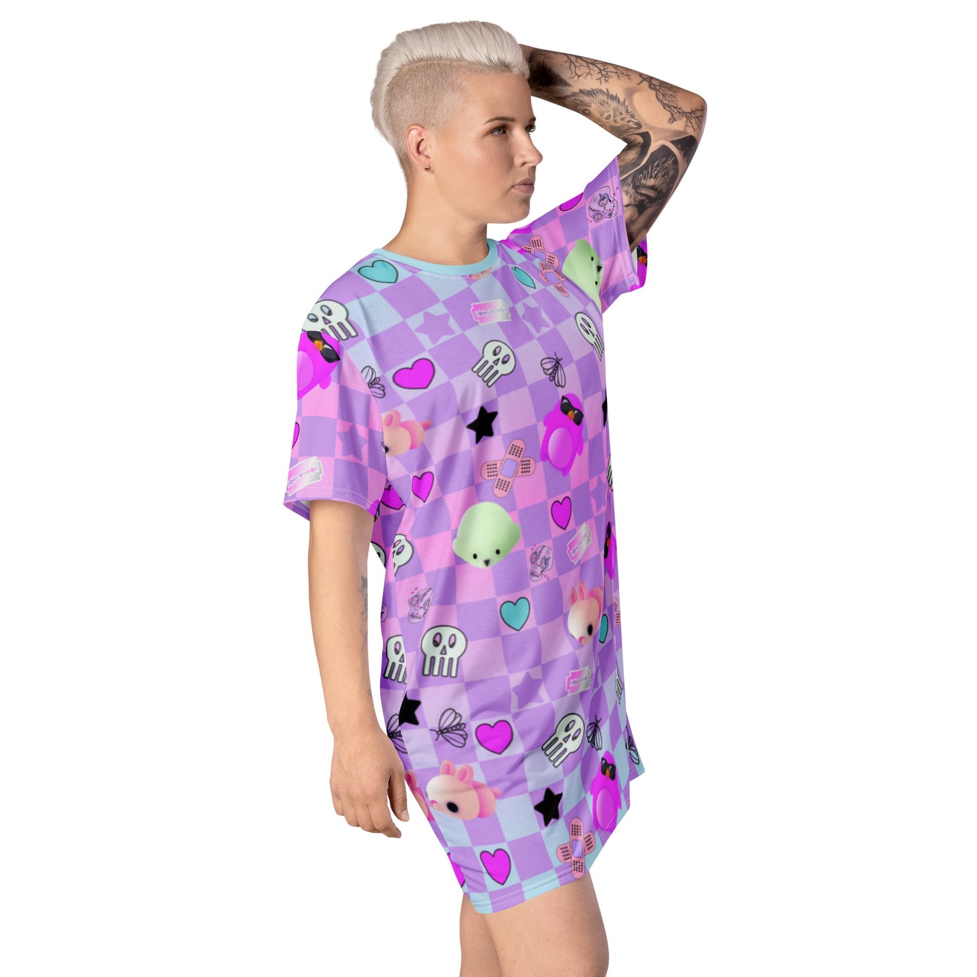 Menhera kei dress in pastel goth style with yami kawaii jfashion harajuku pattern of skulls, razor blades and sticking plasters mixed with yume kawaii cute motifs of mochi penguins, seals and mice against a pastel checked or chequered background.