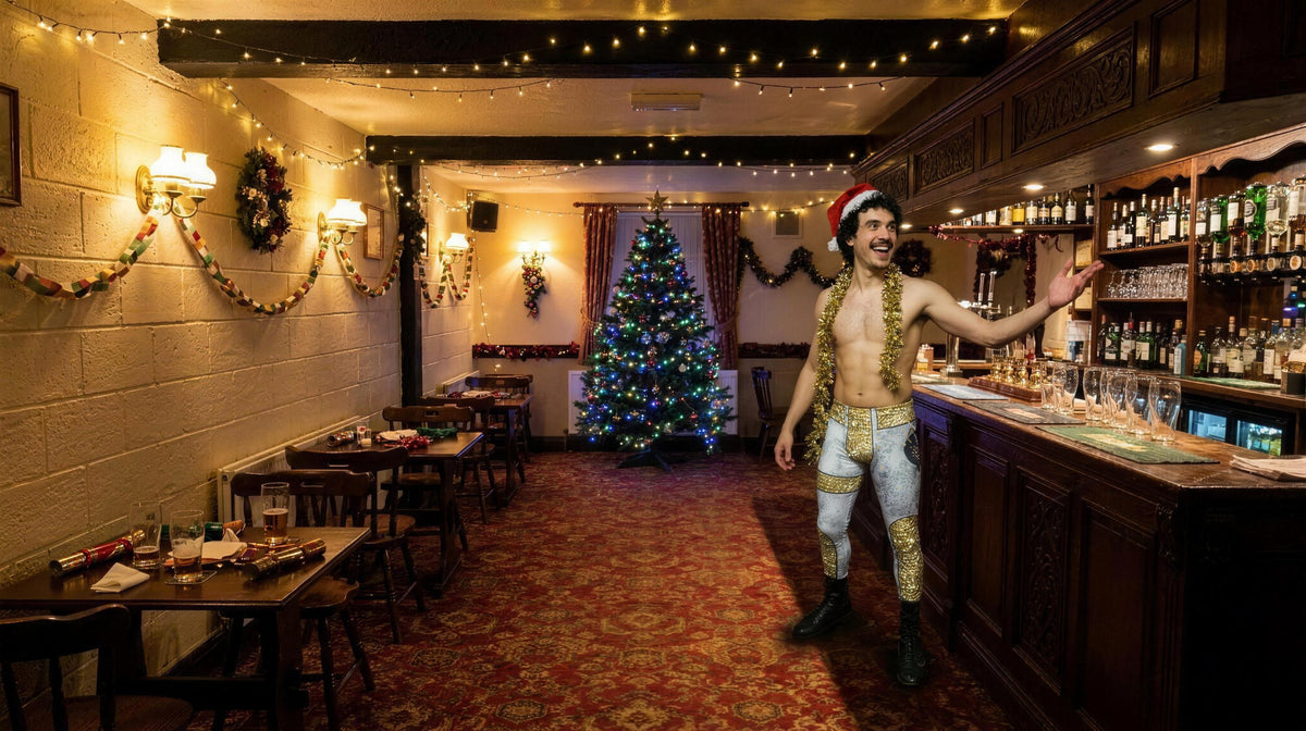 
                Man in gold Star Reign wrestling tights and a Santa hat at a Christmas pub party
              