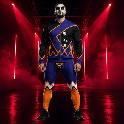 A man wearing a matching black, blue, and orange athletic tights with white graphic details stands in a dramatic red-lit stage setting with spotlights and haze.