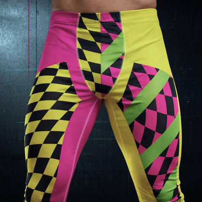 Colorful geometric-patterned pants with pink, yellow, and black design on a dark background - closeup view