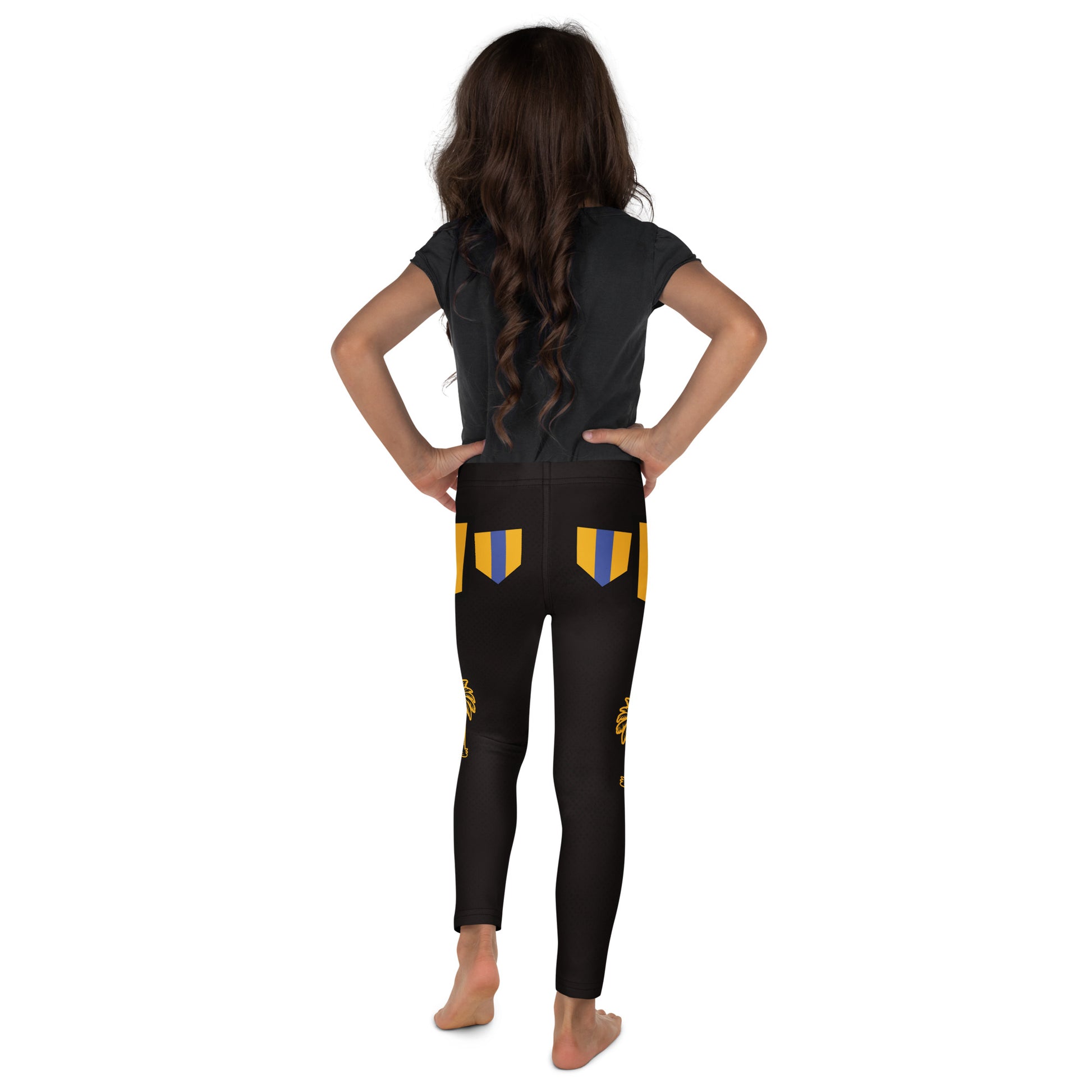 Girl wearing black and gold wrestling-inspired leggings with blue knee panels, facing back