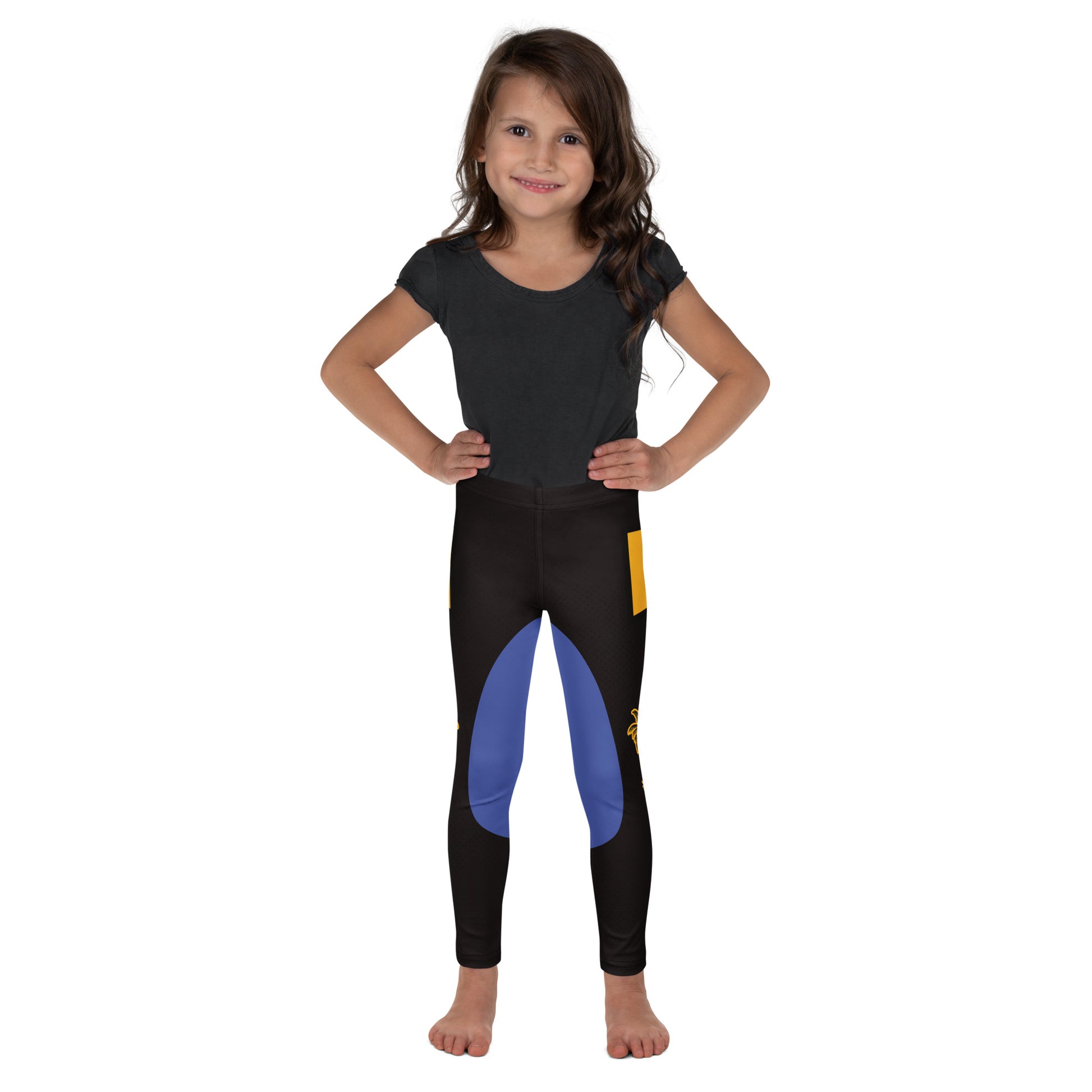 Girl wearing black and gold wrestling-inspired leggings with blue knee panels