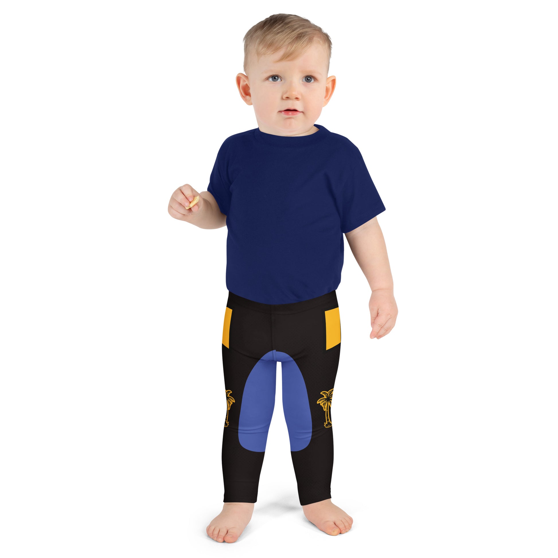 Toddler wearing black and gold wrestling-inspired leggings with blue knee panels