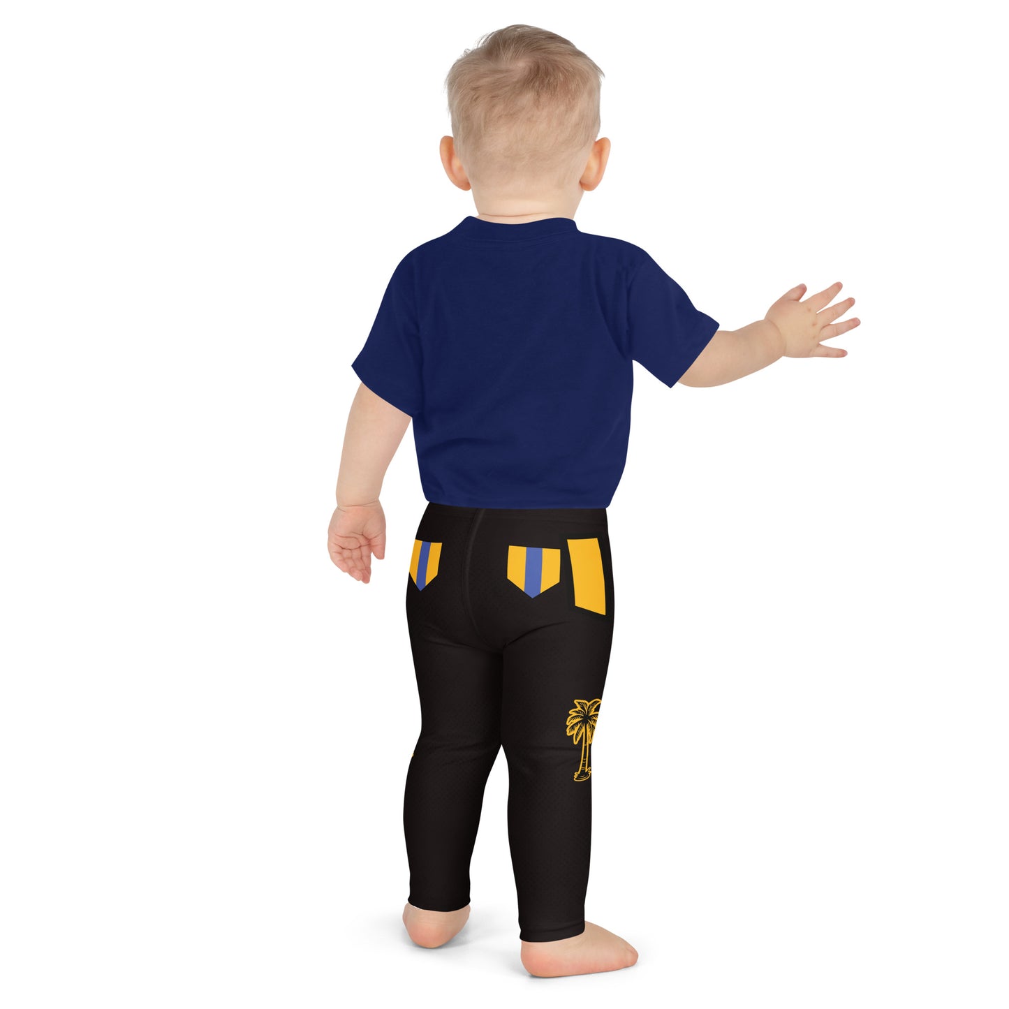 Child wearing black and gold wrestling-inspired leggings with blue knee panels, back view
