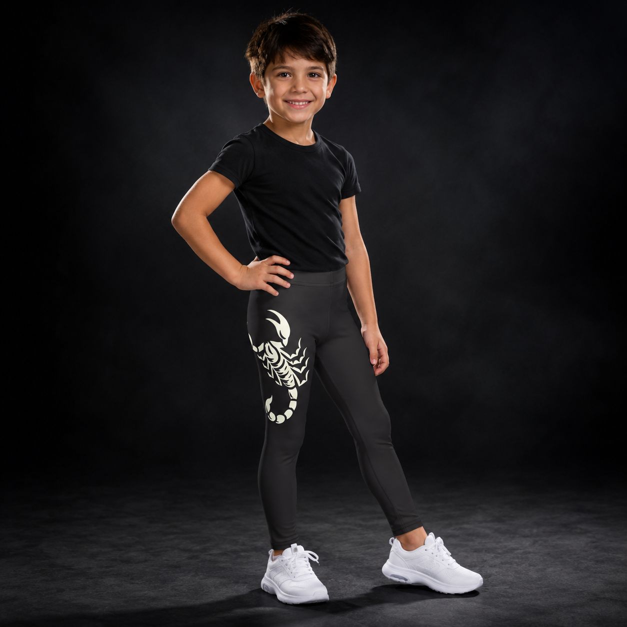 Child wearing dark leggings with large printed scorpion on the outside leg