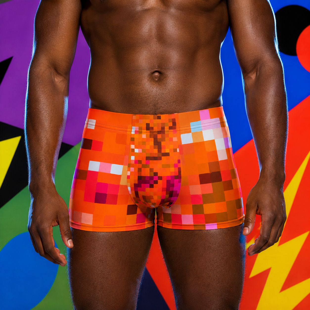 Person wearing colorful pixelated orange boxer briefs against a multicolored abstract background