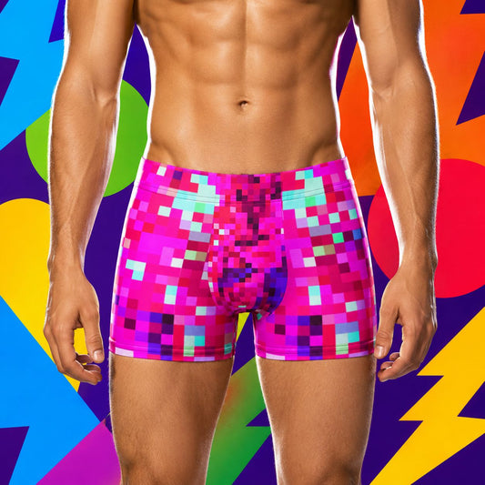 Person wearing colorful pink pixelated boxer briefs against a multicolored abstract background