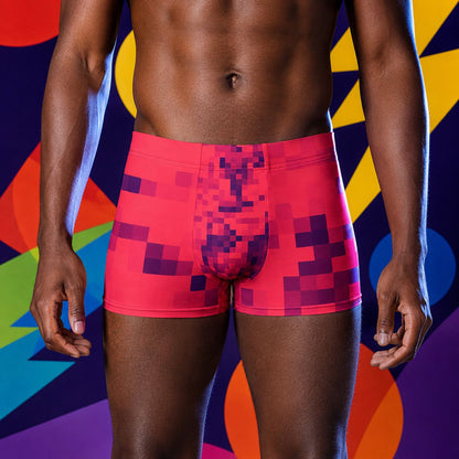 Person wearing red pixel-patterned boxer briefs underwear against a colorful abstract background