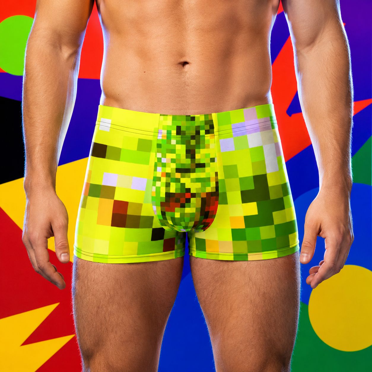Person wearing colorful yellow pixelated boxer briefs against a multicolored abstract background