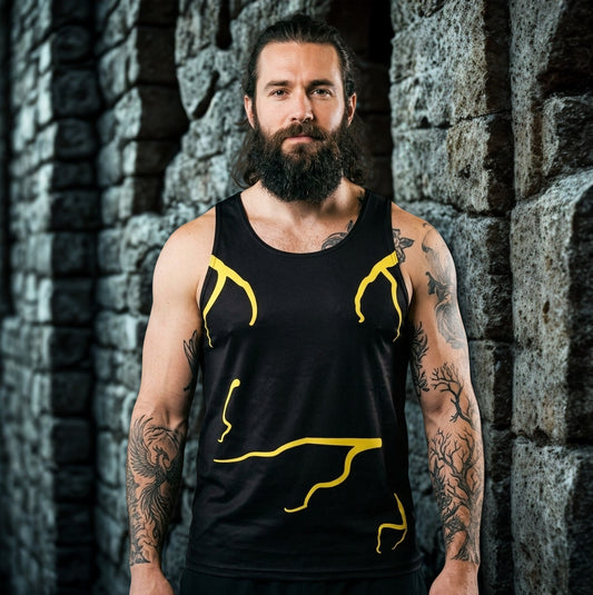 Man wearing a black tank top  with molten yellow designs against a gothic stone wall in spooky image