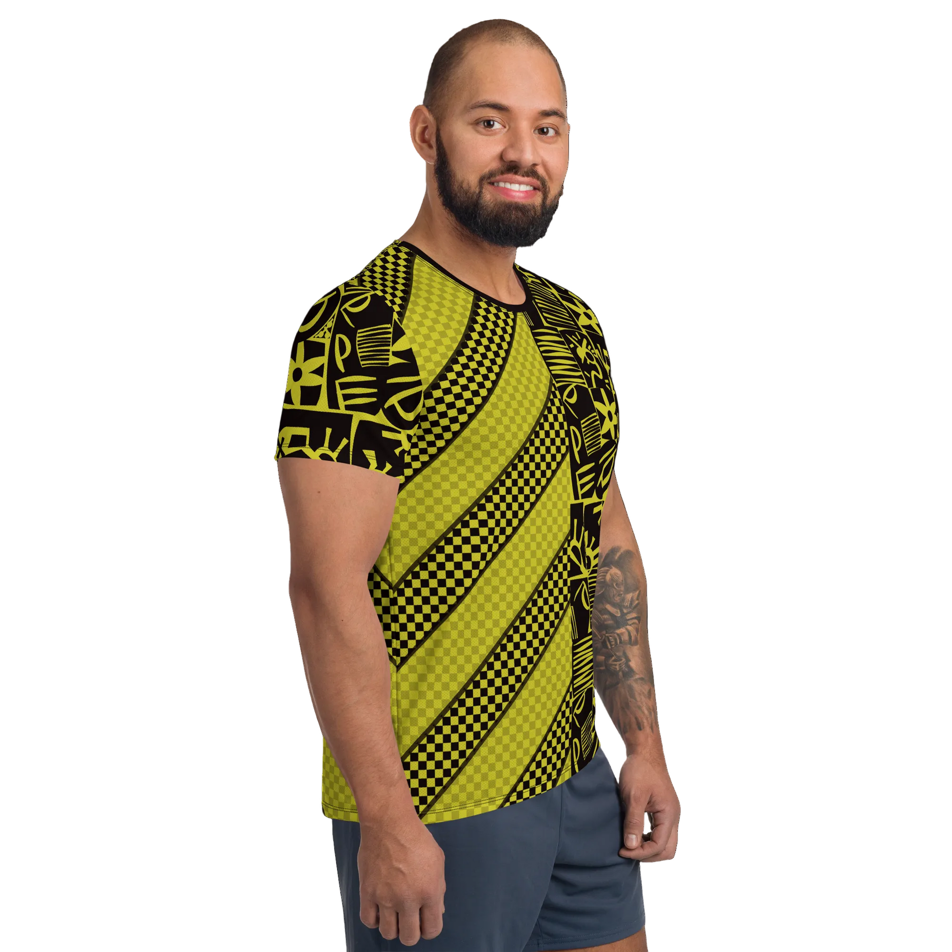 Man wearing a black and yellow patterned striped and polka dot geometric t-shirt.