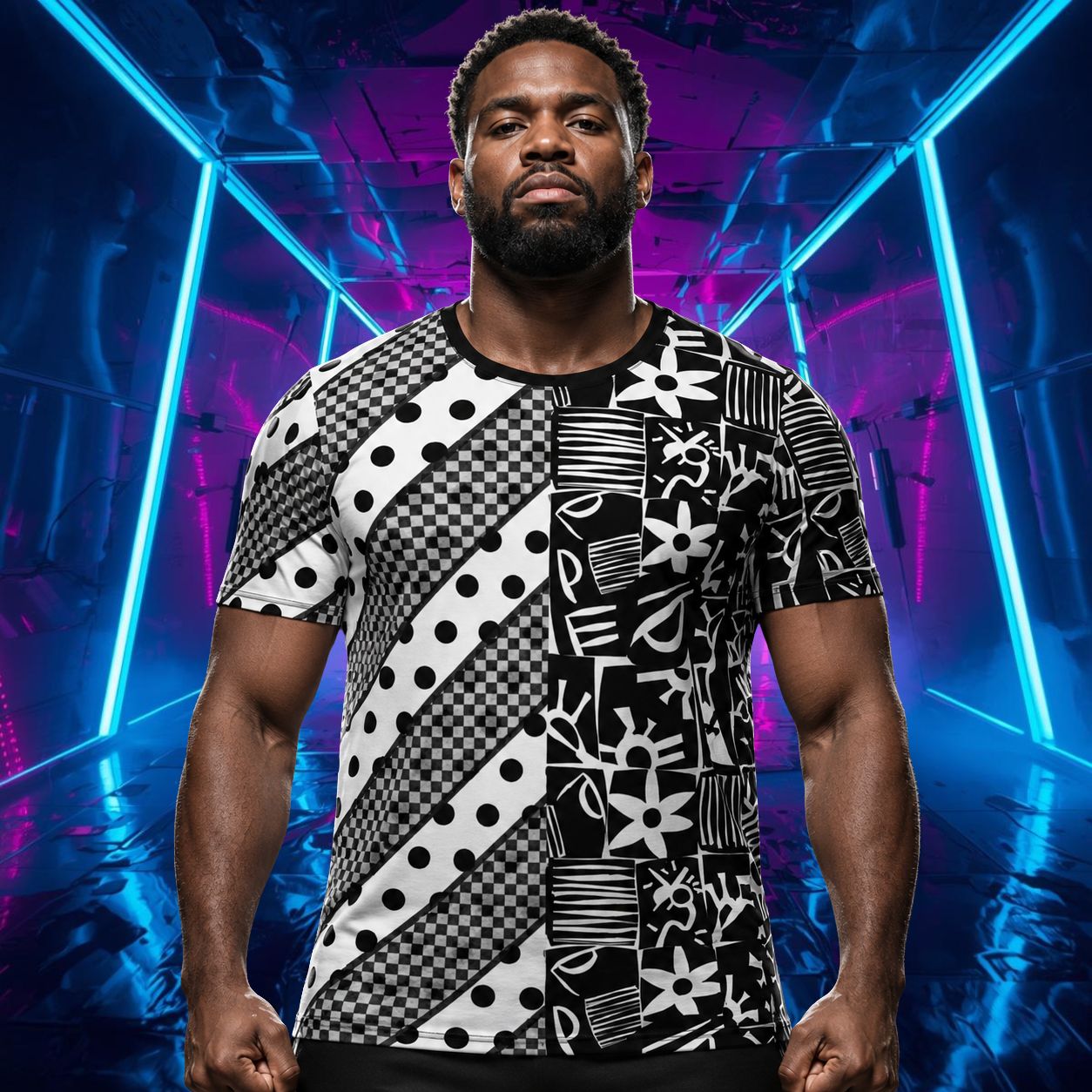 Man wearing a black and white retro 80s Memphis style athletic t-shirt wiht a split design, with diagonal rows, polka dots, checks, block shapes.