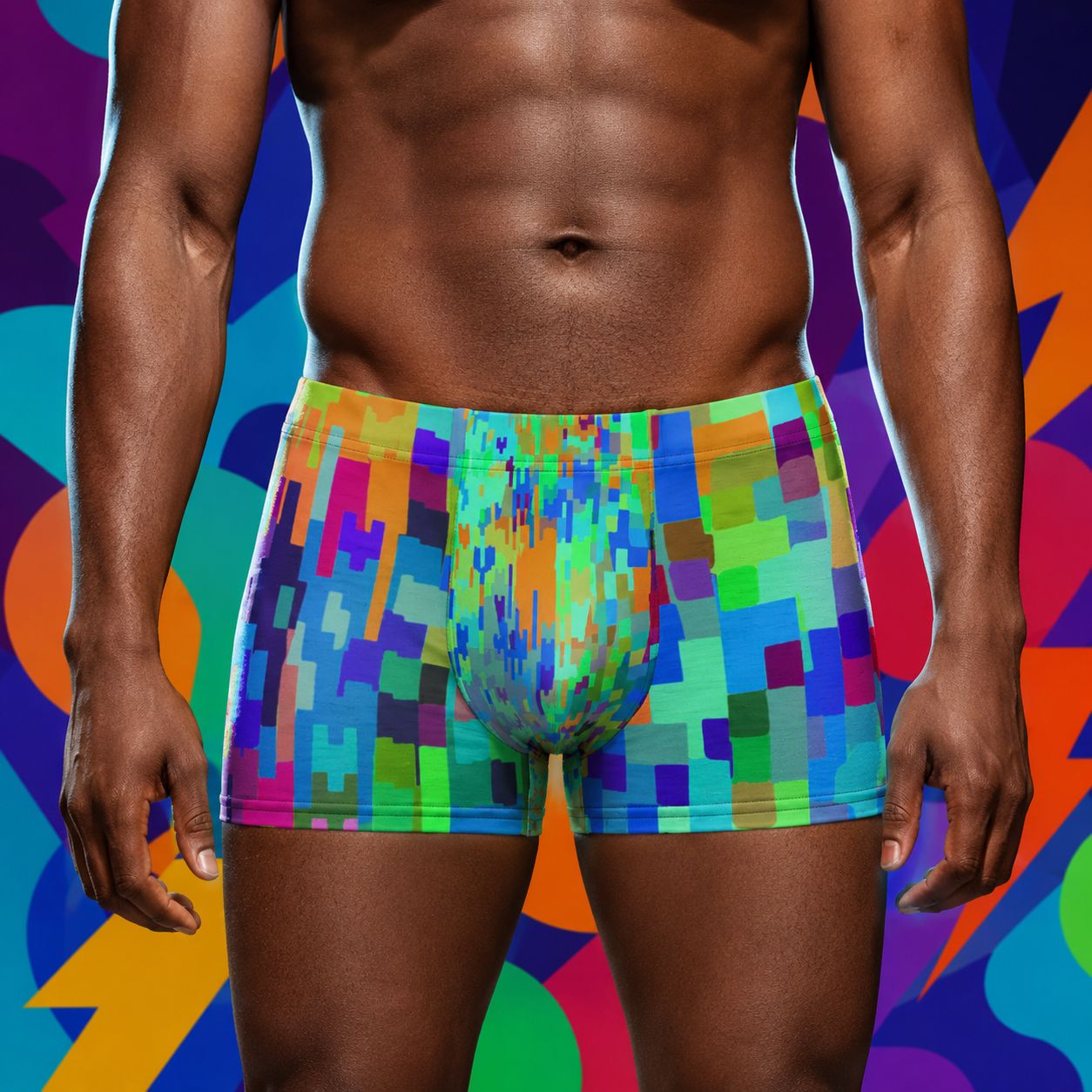 Person wearing colorful pixelated boxer briefs against a multicolored abstract background