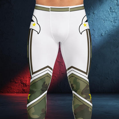 White and olive green camouflage athletic compression pants with eagle head graphics and yellow star accents, shown on a cropped lower torso against a dark studio backdrop with red and blue lighting.