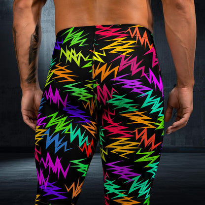 Colorful zigzag patterned wrestling pants on a person against a dark background