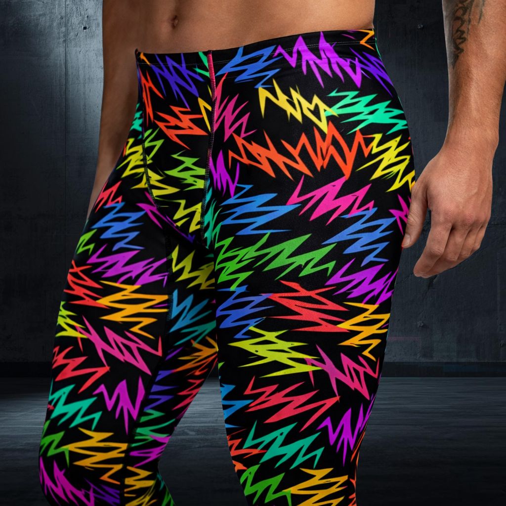 Colorful rainbow zigzag patterned bold fashion leggings on a person against a dark background