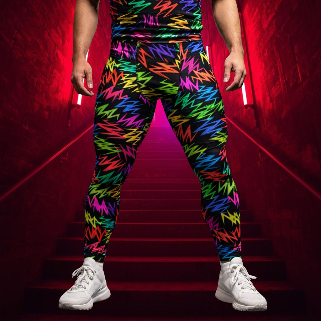 Men's rave and bold fashion leggings in rainbow zigzag design over black.
