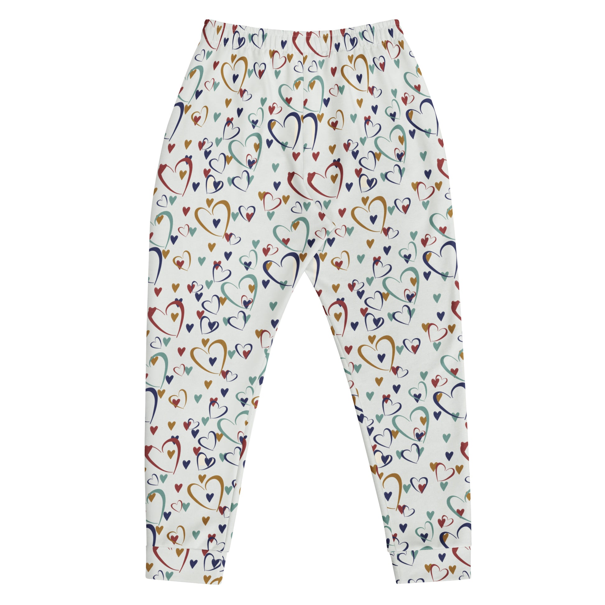 flat laid white leggings with rainbow colored hearts pattern