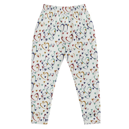 flat laid white leggings with rainbow colored hearts pattern