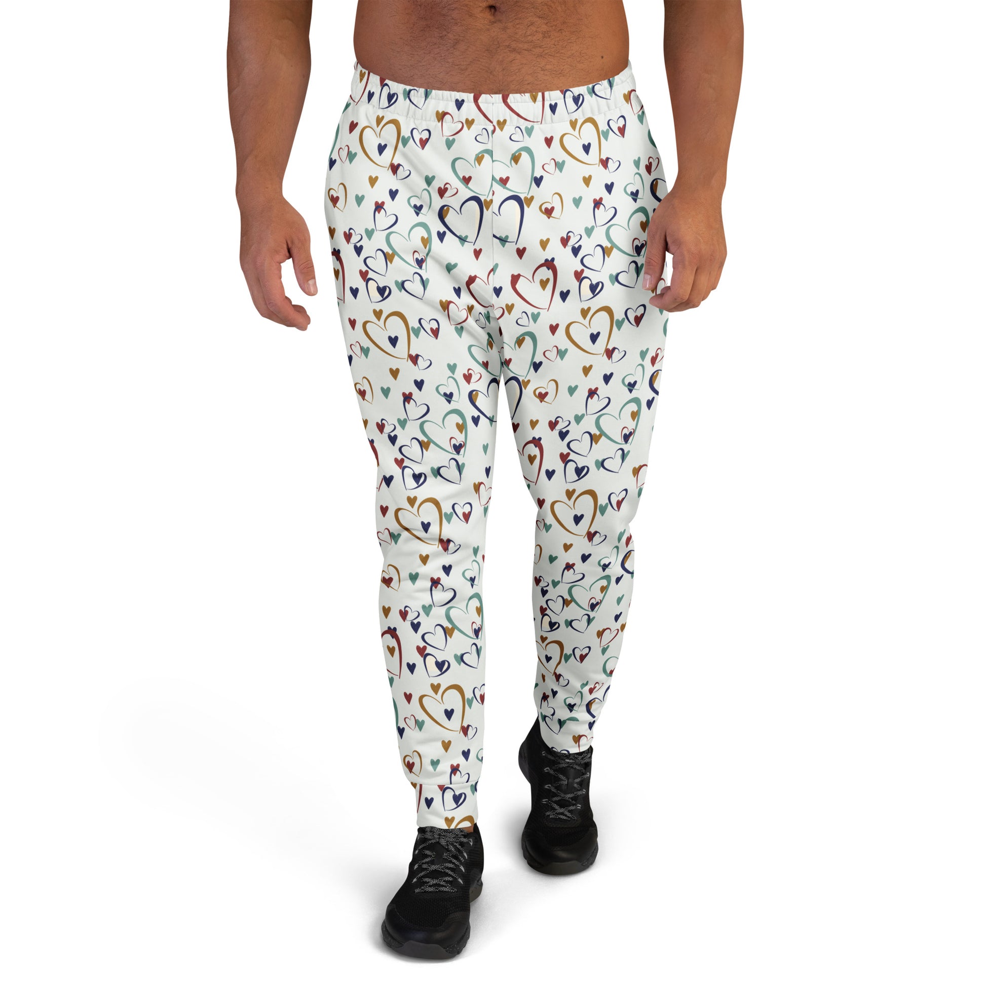 man wearing white leggings with rainbow colored hearts pattern