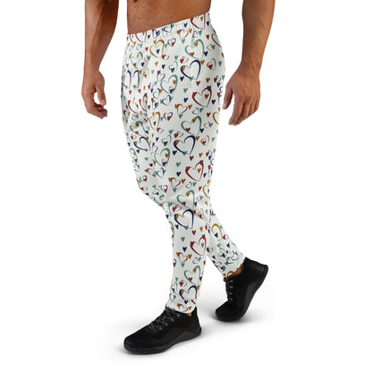 man wearing white leggings with rainbow colored hearts pattern