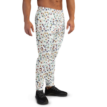 man wearing white leggings with rainbow colored hearts pattern
