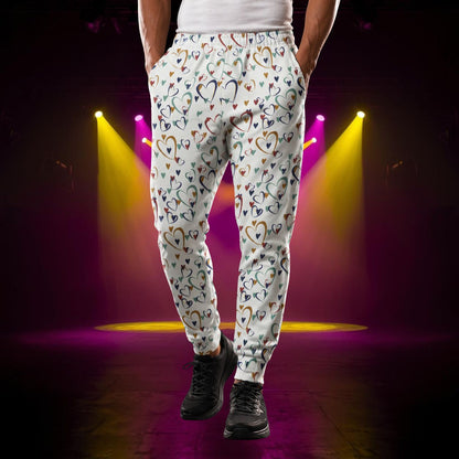 man wearing joggers with rainbow hearts design in glam spectacle wrestling vibes