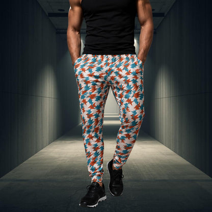 Person wearing colorful patterned jogging pants in a dark hallway