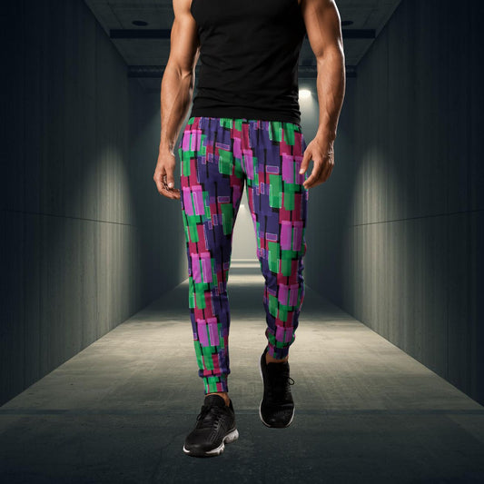 Person wearing colorful checkered jogging pants walking down a dark hallway.
