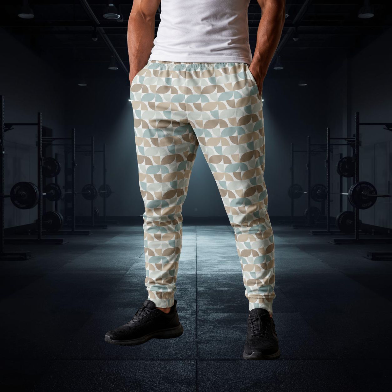 Person wearing pastel geometric patterned jogger pants in a gym setting